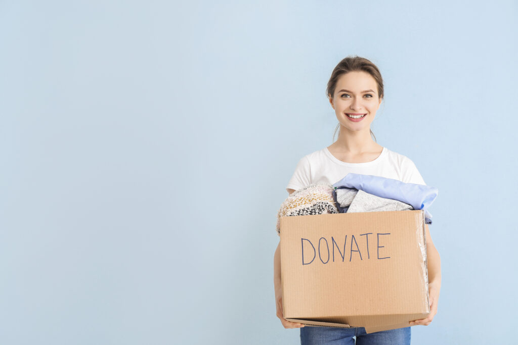 woman holding a donations box
