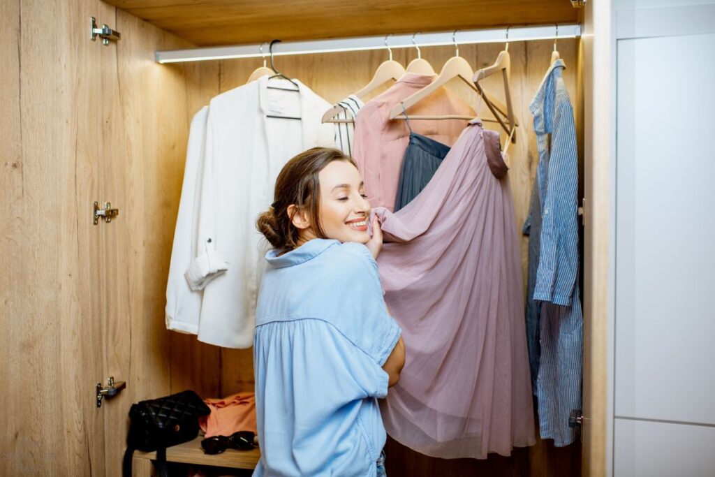 woman embracing a skirt in her closet