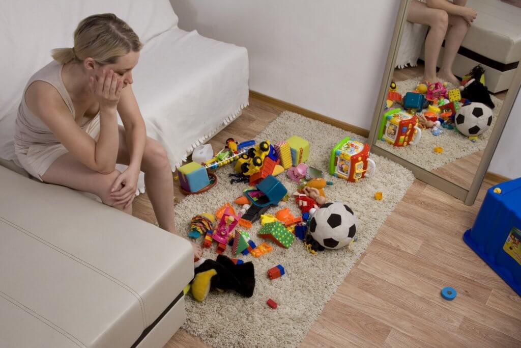 toy clutter with a tired mom