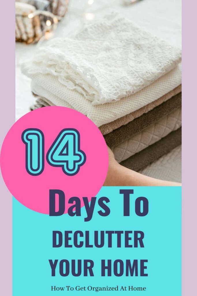 clothes in a tidy pile with the words 14 days to declutter your home