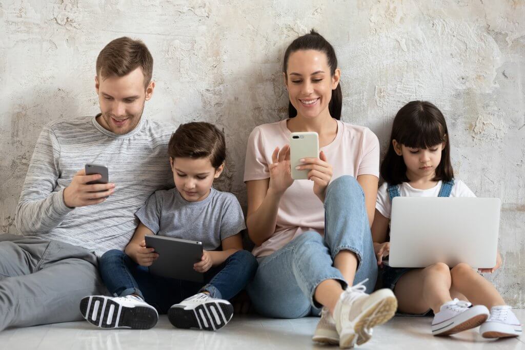 family on tech devices