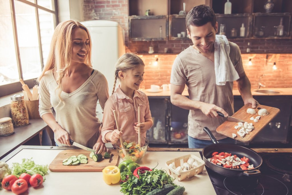 family making dinner together