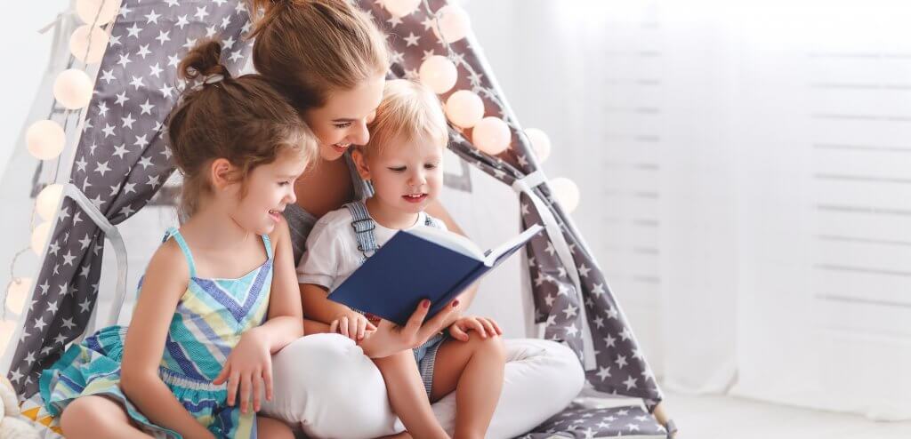 mom reading to her children