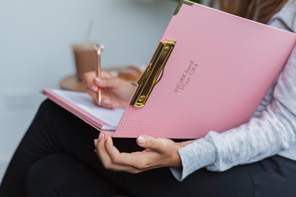 woman writing in a notebook