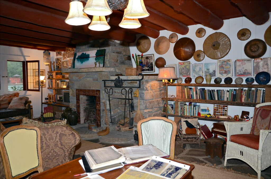 living room with a lot of decor and clutter