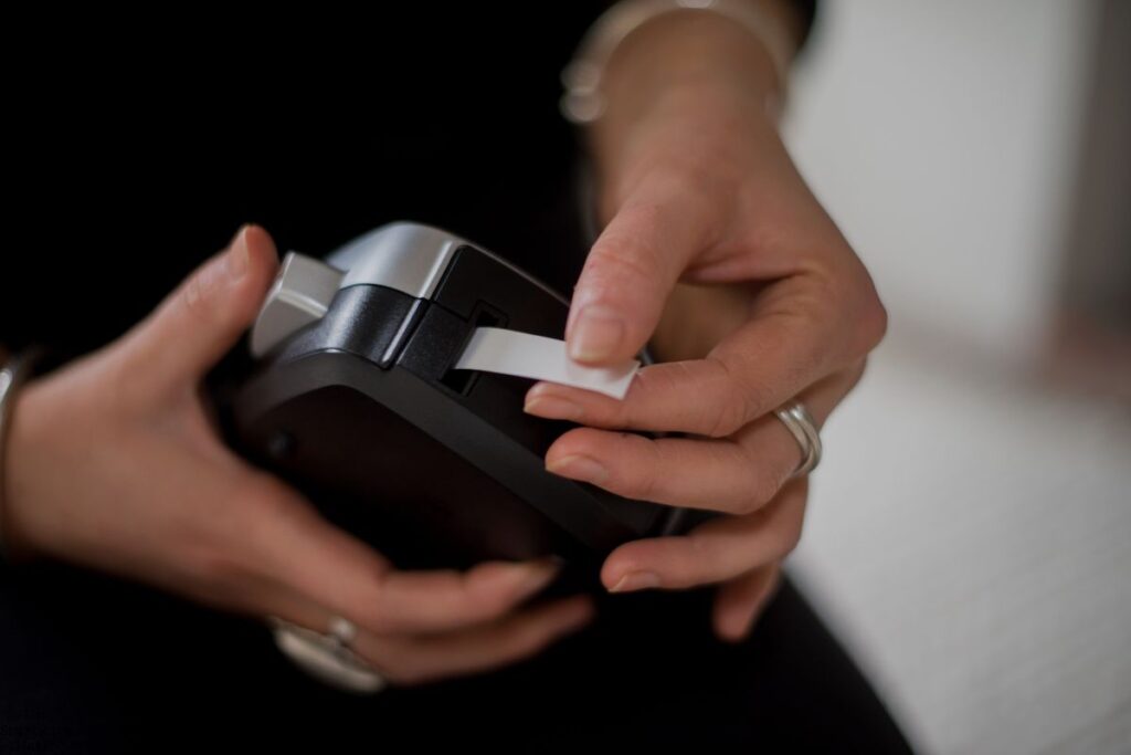 woman holding a label maker