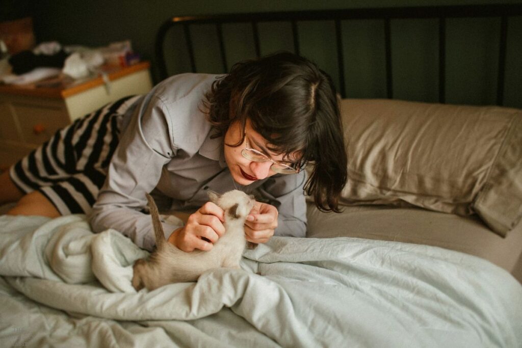 woman petting cat