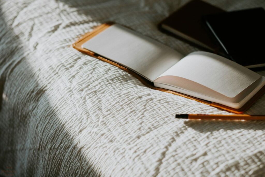 open journal on a bed