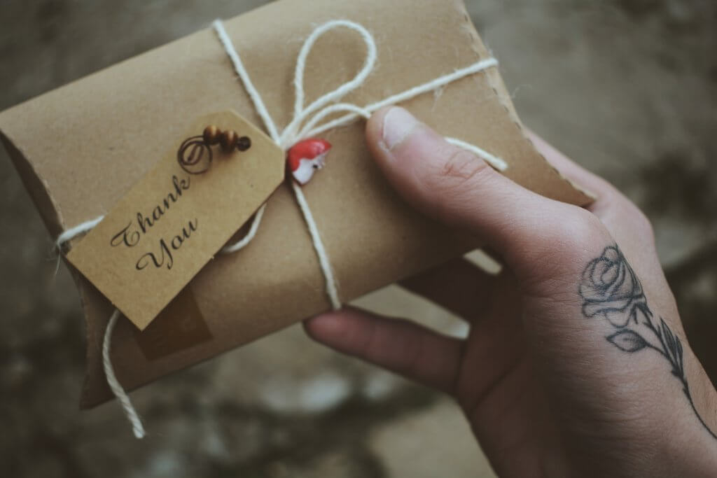 person holding a gift