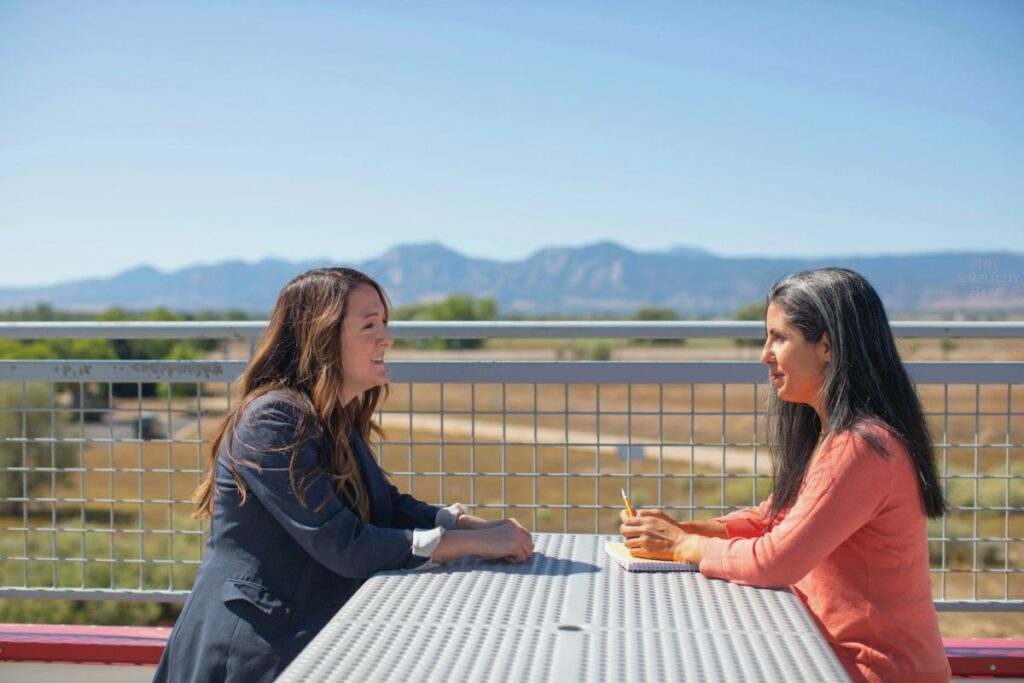 friends talking while sitting at a table