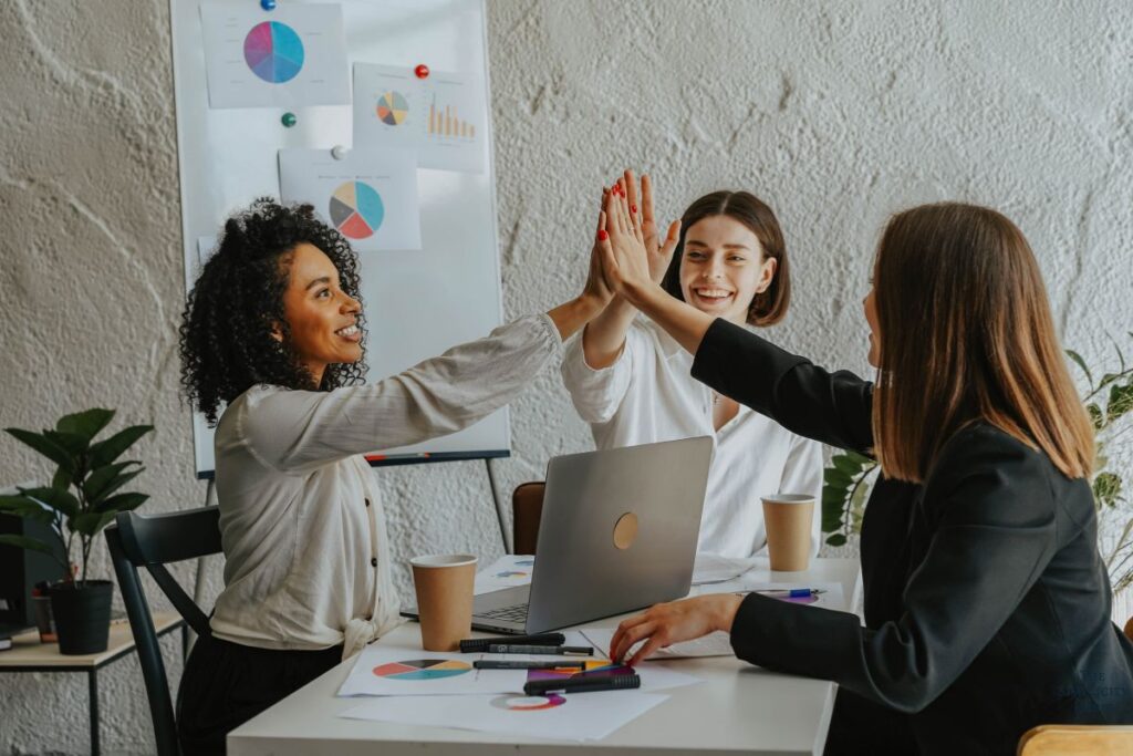 women giving each other high fives